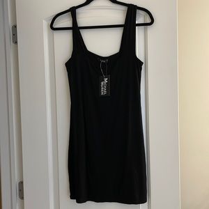 Simple black cotton dress brand new with tags size small. Nice summer staple.